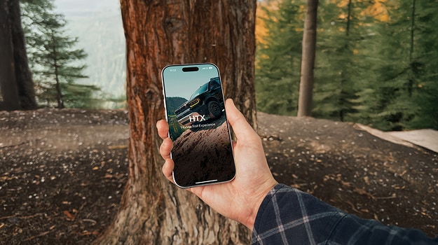 2026 Honda Pilot TrailSport close up of the center touchscreen displaying vehicle status and Apple CarPlay.