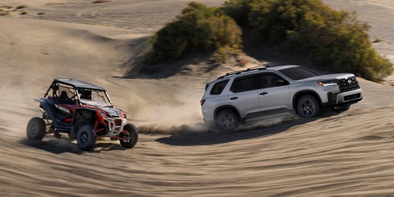 2026 Honda Pilot TrailSport shown in Solar Silver Metallic with Honda Genuine Accessories