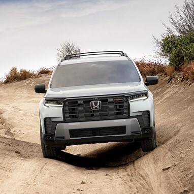 2026 Honda Pilot TrailSport shown in Platinum White Pearl with Honda Genuine Accessories front view 