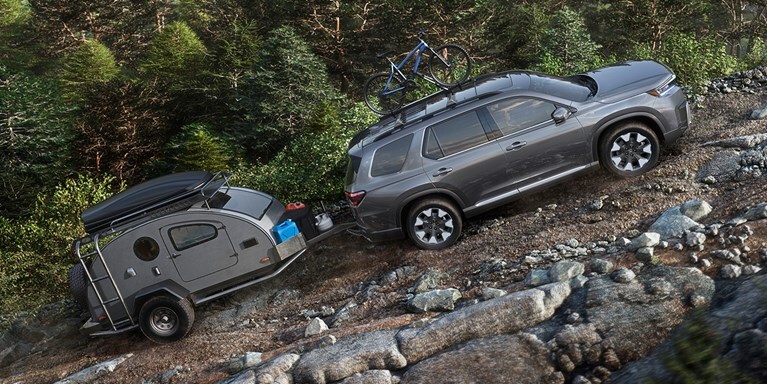 2026 Honda Pilot Elite shown in Modern Steel Metallic with Honda Genuine Accessories.