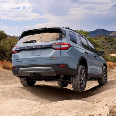 2026 Honda Pilot TrailSport shown in Sonic Gray Pearl rear view
