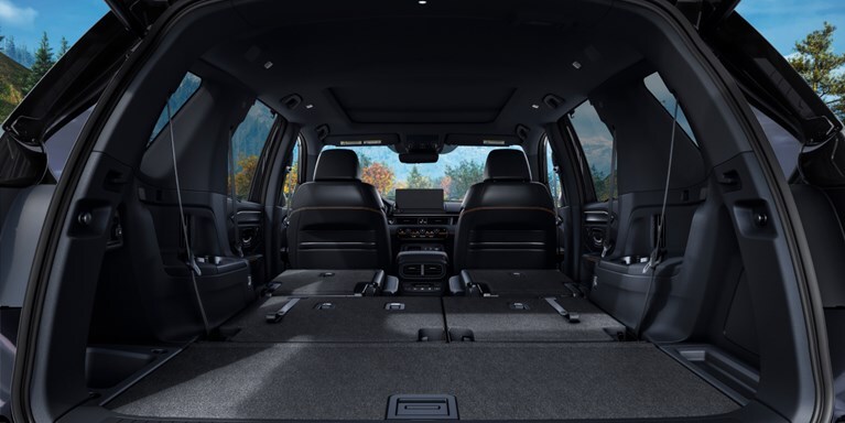 2026 Honda Pilot TrailSport shown with Black Durable Synthetic Leather and cargo storage