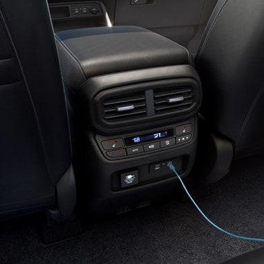 2026 Honda Pilot Elite shown with Black Leather with the rear center console