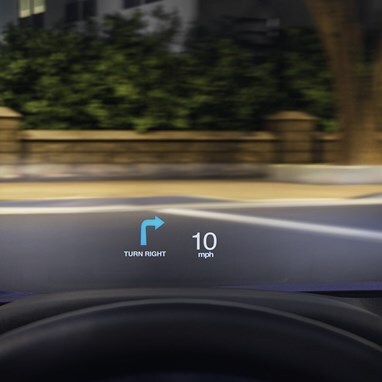 Head-Up Display detail of 2026 Honda Accord driving along neighborhood street at night.