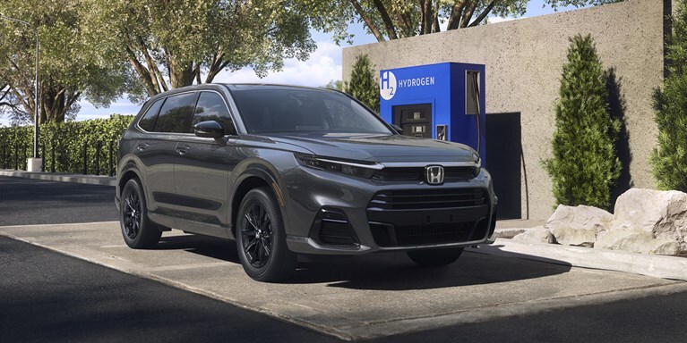 2026 CR-V e:FCEV in Meteorite Gray Metallic charging in a Hydrogen Station