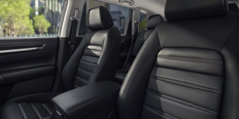 Interior of 2026 R-V e:FCEV in Platinum White Pearl with black interior eco-friendly front seats.