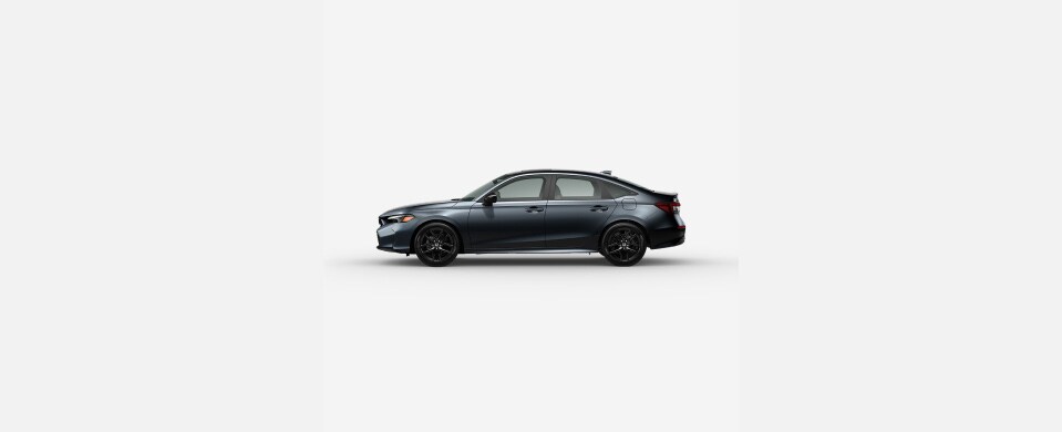2026 Honda Civic Sedan Sport Hybrid in Meteorite Gray Metallic profile parked in a clean white studio setting (Compact Sedan).